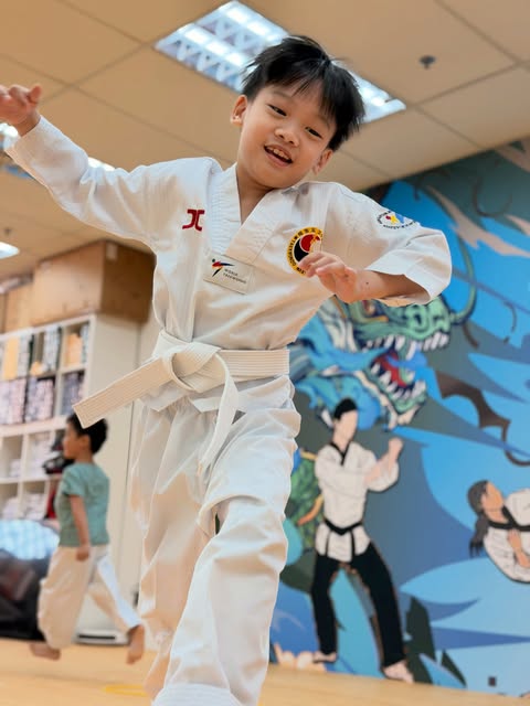 Young student mid-training, all smiles
